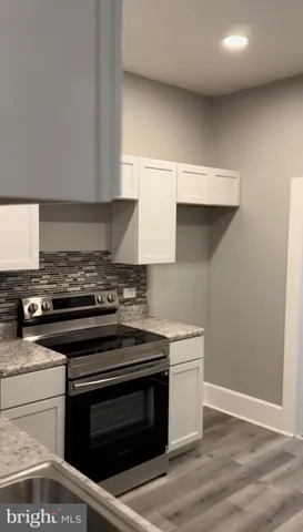 a kitchen with a stove and a sink