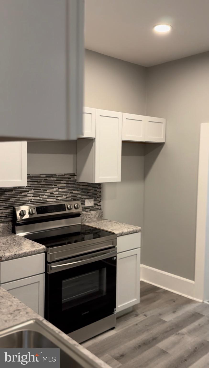 521 Windsor Street Reading, PA 19601 - Photo 6 of 14 a kitchen with a stove and a sink