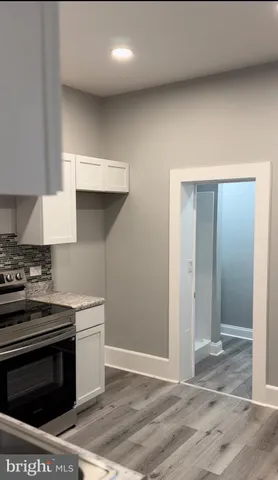 a kitchen with a stove and a sink