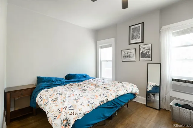 a bedroom with a bed and a night stand