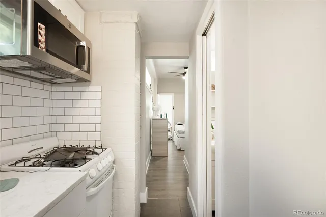 a kitchen with a stove and a microwave