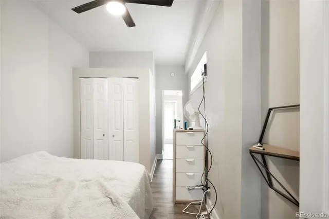 a bath room with a couch and a window