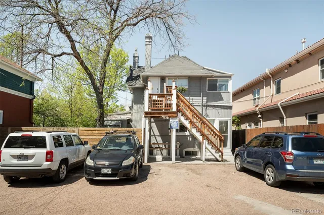 a view of a patio with table and chairs and potted plants