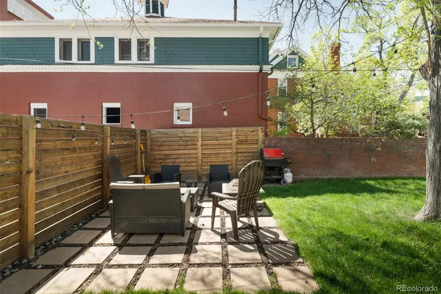 a view of yard with patio