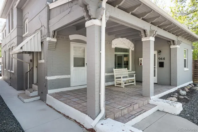 a view of a hallway with glass door and glass door