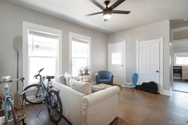 a living room with furniture a table and a window