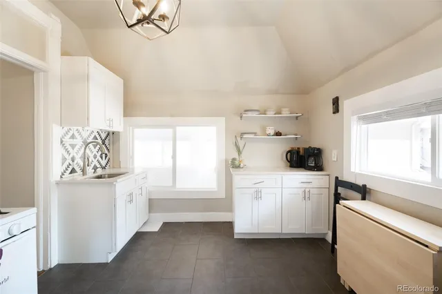 a kitchen with a cabinets and window