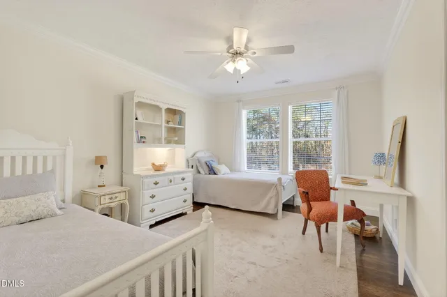 a bedroom with a bed and a table