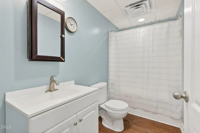 a view of an empty room with wooden walls