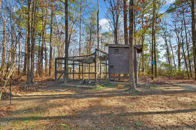 a house with swimming pool in front of it
