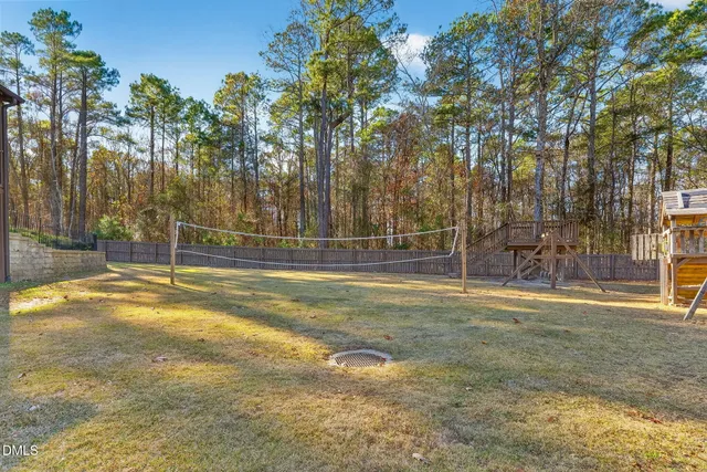 a view of outdoor space with wooden fence