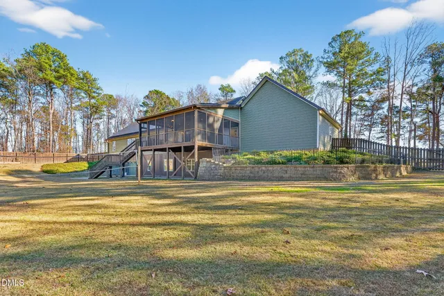 a view of a house with a yard and garage