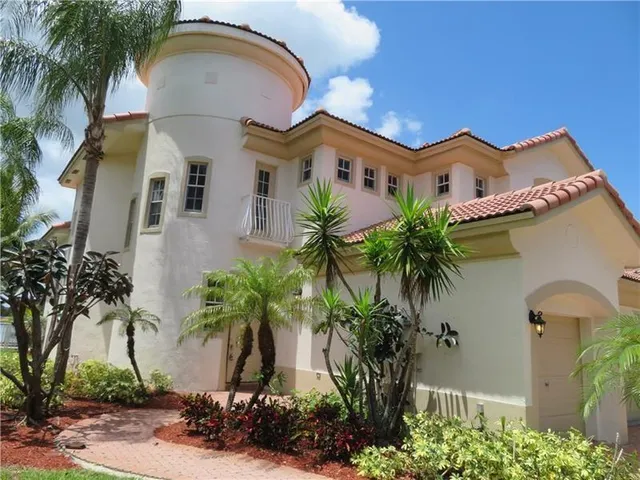 a front view of house with yard and outdoor seating
