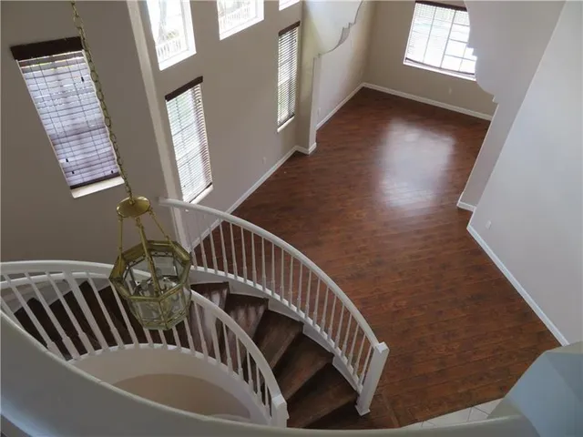 a kitchen with stainless steel appliances granite countertop a refrigerator stove and oven