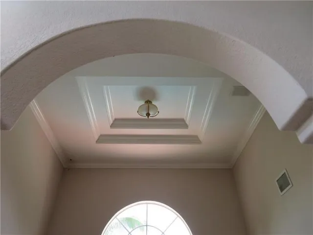 a room with window and a rug