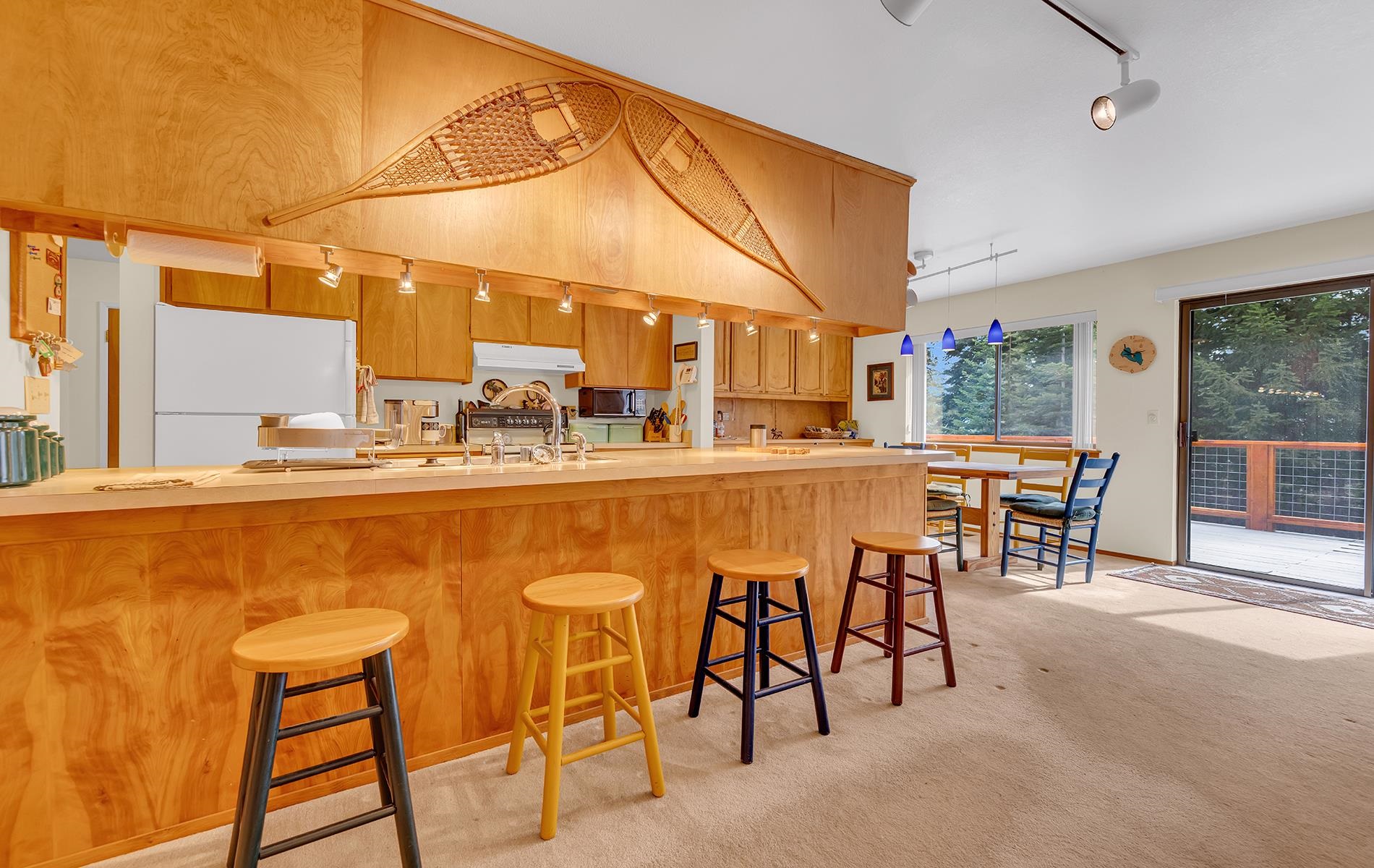 608 East Burnt Cedar Road Lake Almanor, CA 96137 - Photo 12 of 36 a dining hall with stainless steel appliances kitchen island granite countertop furniture and a large window