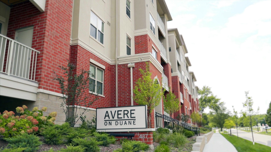 437 Duane Street, Unit 108 Glen Ellyn, IL 60137 - Photo 1 of 11 a sign on a pole on a street