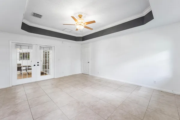 a house view with swimming pool in front of it