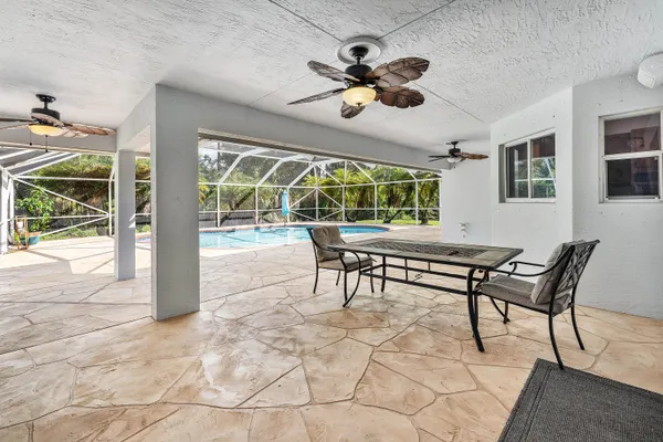 a view of a kitchen with a sink and a stove top oven