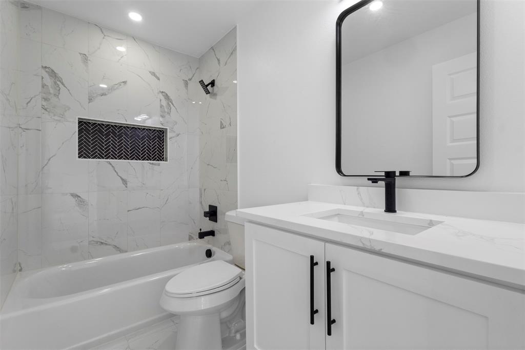 180 County Road 2245 Emory, TX 75440 - Photo 20 of 34 a bathroom with a sink a toilet and shower