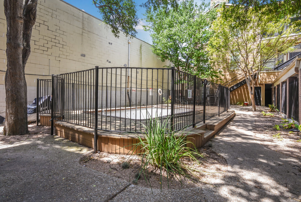 2802 Nueces Street, Unit 307 Austin, TX 78705 - Photo 4 of 16 a view of a backyard with a tree