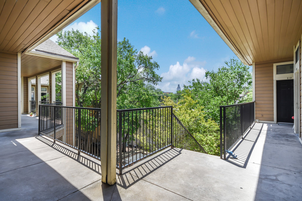 2802 Nueces Street, Unit 307 Austin, TX 78705 - Photo 5 of 16 a view of a balcony with wooden floor