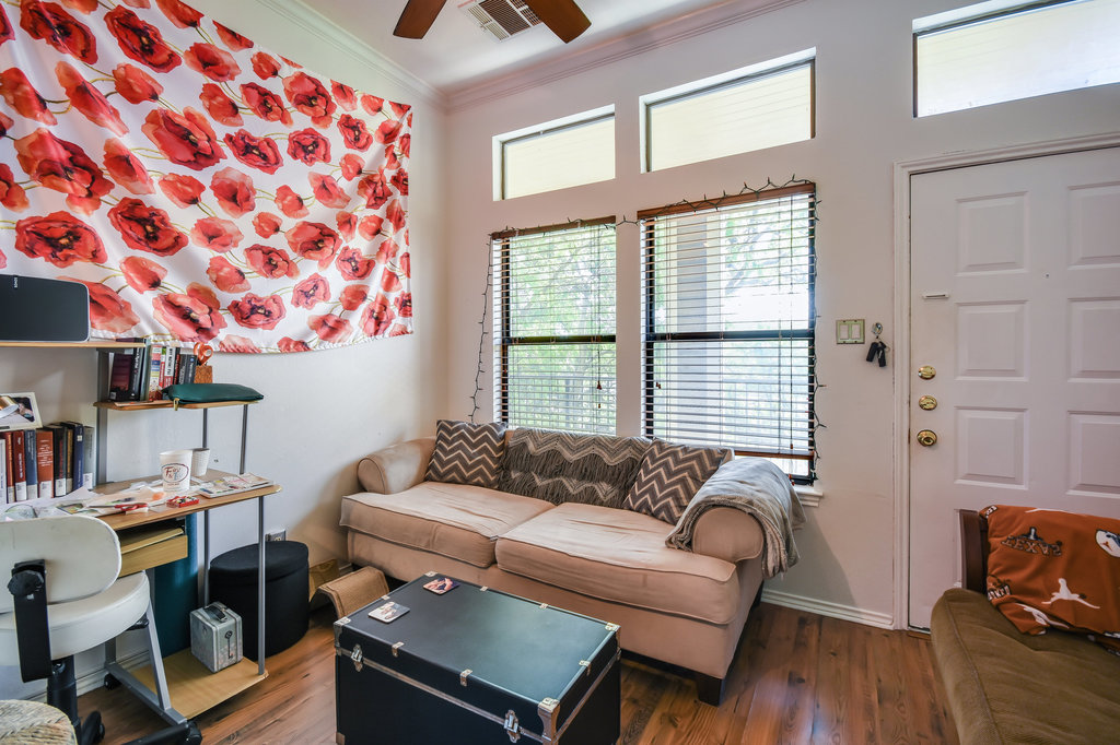 2802 Nueces Street, Unit 307 Austin, TX 78705 - Photo 9 of 16 a living room with furniture and a window