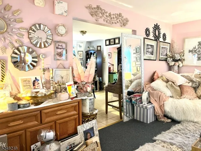 a view of living room filled with furniture and rug