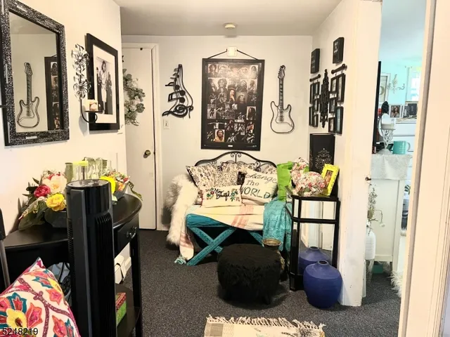 a living room with furniture and a rug