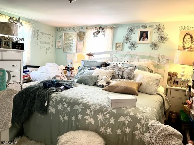 a view of a white house with yard