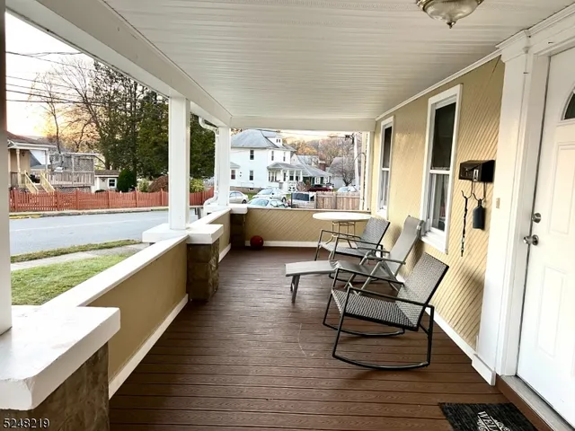 a view of a living room and kitchen with a large window