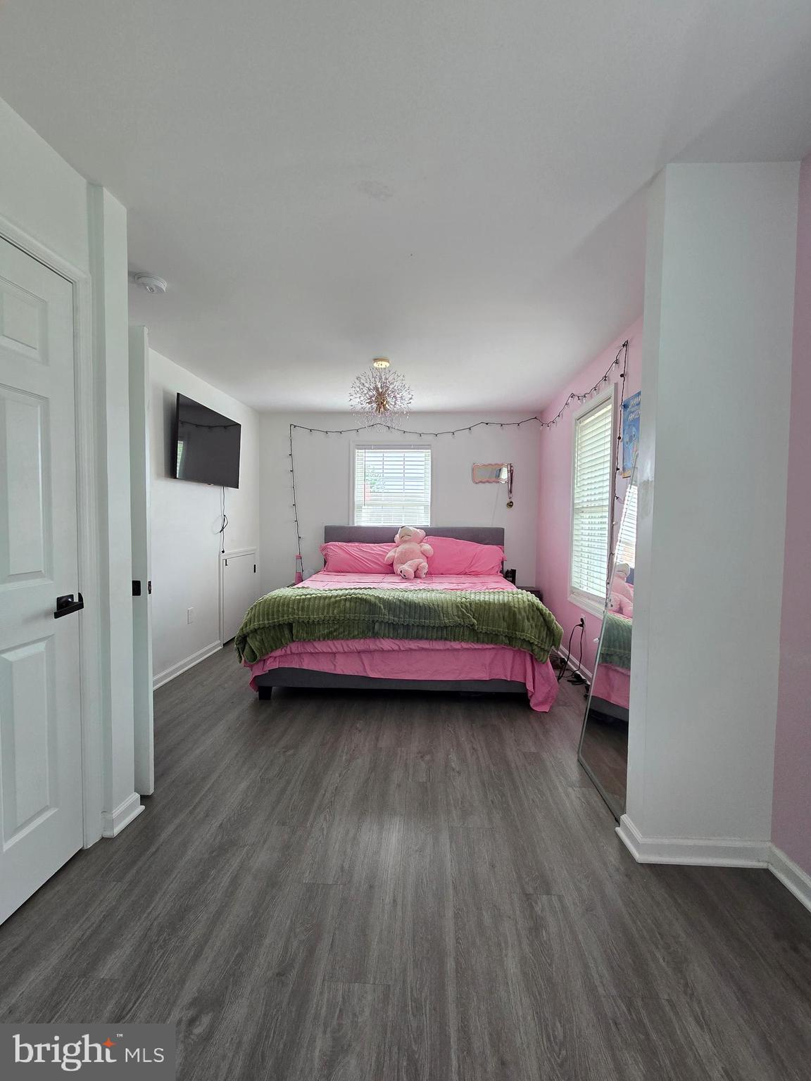 7513 Saffron Court Hanover, MD 21076 - Photo 15 of 42 a bedroom with a bed and wooden floor