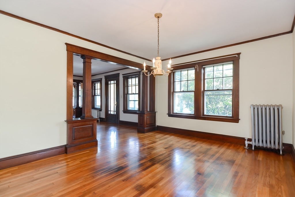 2 Prospect Street Milford, MA 01757 - Photo 11 of 31 a view of an empty room with wooden floor and a window