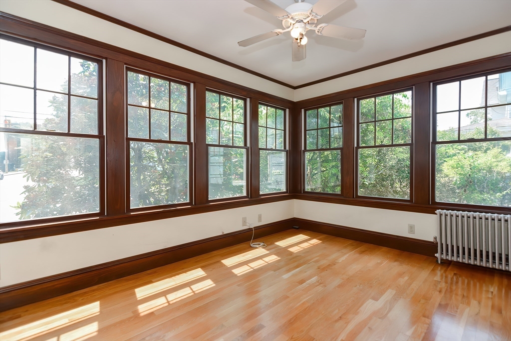 2 Prospect Street Milford, MA 01757 - Photo 13 of 31 a view of an empty room with wooden floor and a window