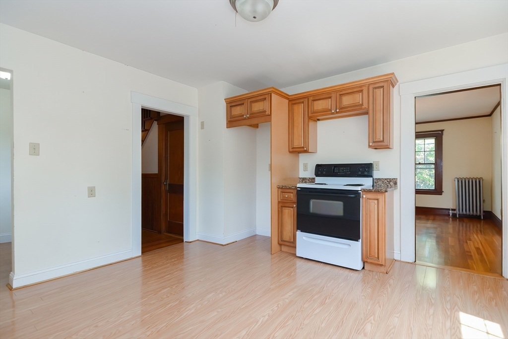 2 Prospect Street Milford, MA 01757 - Photo 16 of 31 a kitchen with stainless steel appliances a stove and a refrigerator