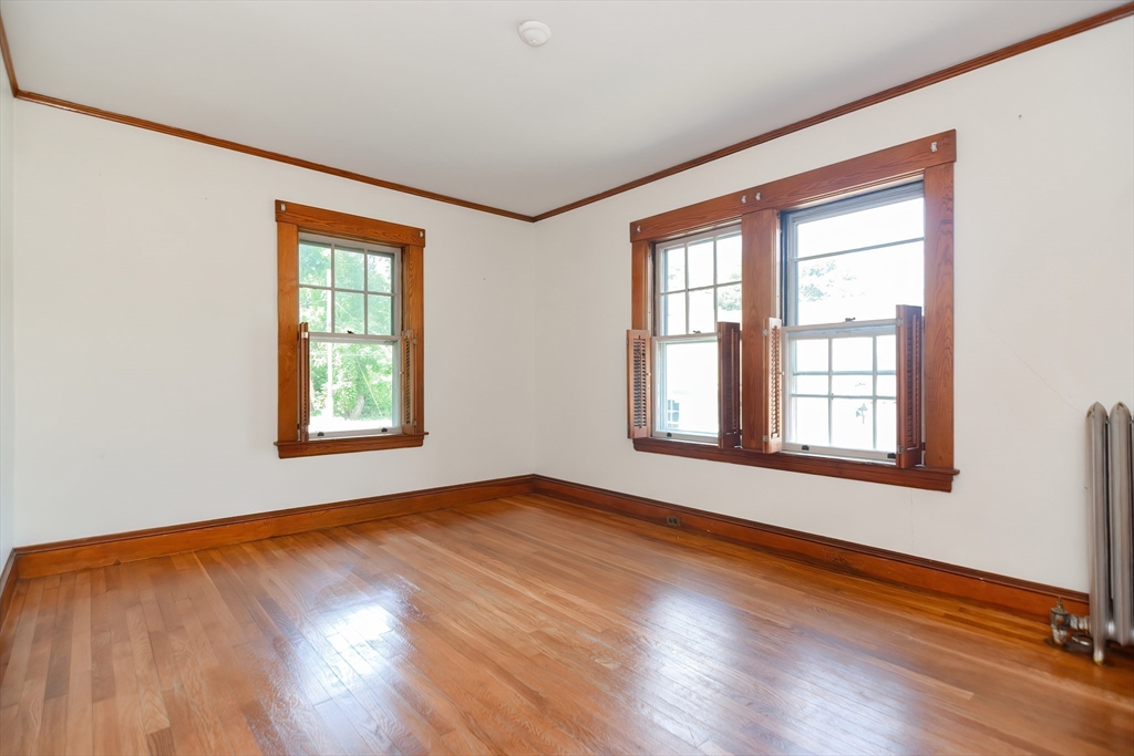 2 Prospect Street Milford, MA 01757 - Photo 22 of 31 an empty room with wooden floor and windows