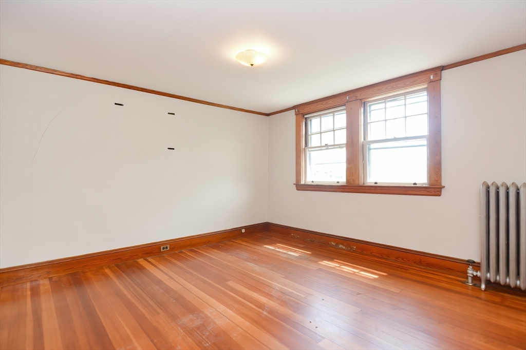 2 Prospect Street Milford, MA 01757 - Photo 23 of 31 an empty room with wooden floor and windows
