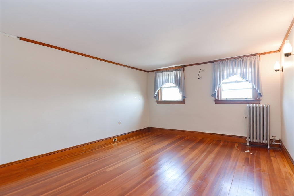 2 Prospect Street Milford, MA 01757 - Photo 25 of 31 an empty room with wooden floor and windows