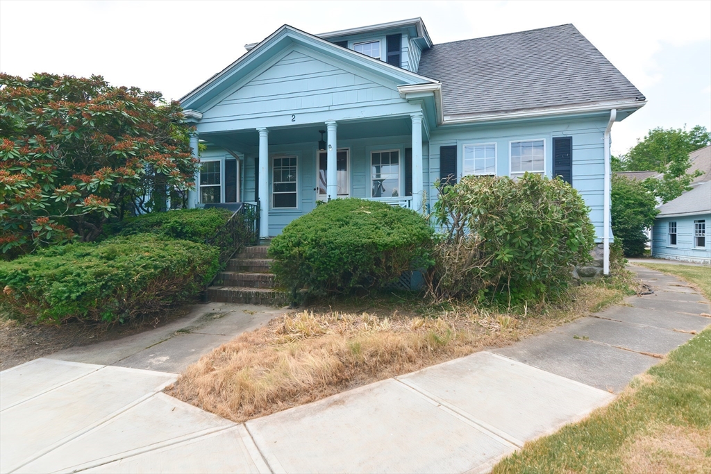 2 Prospect Street Milford, MA 01757 - Photo 3 of 31 a front view of a house with garden