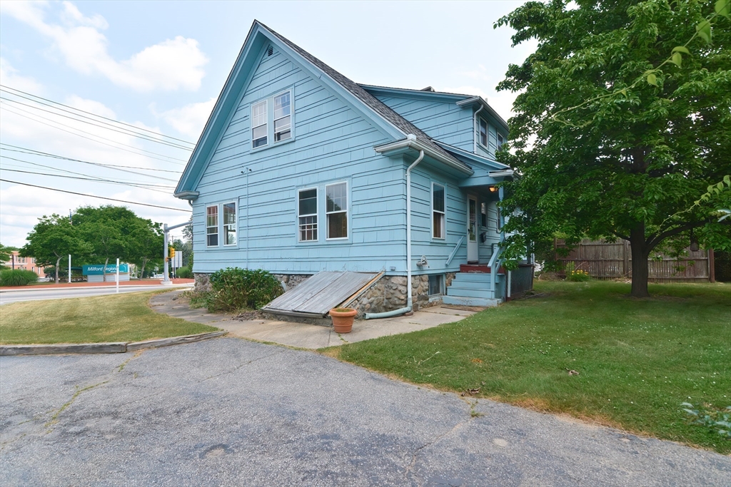 2 Prospect Street Milford, MA 01757 - Photo 4 of 31 a view of back yard of the house