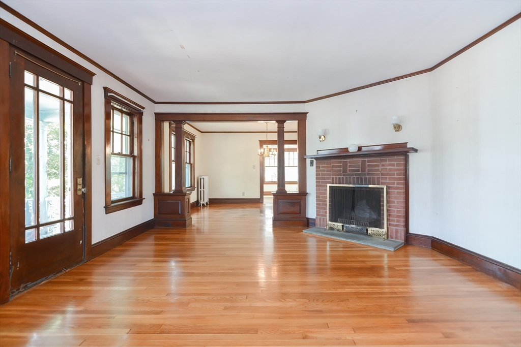2 Prospect Street Milford, MA 01757 - Photo 7 of 31 a view of an empty room with glass door and windows