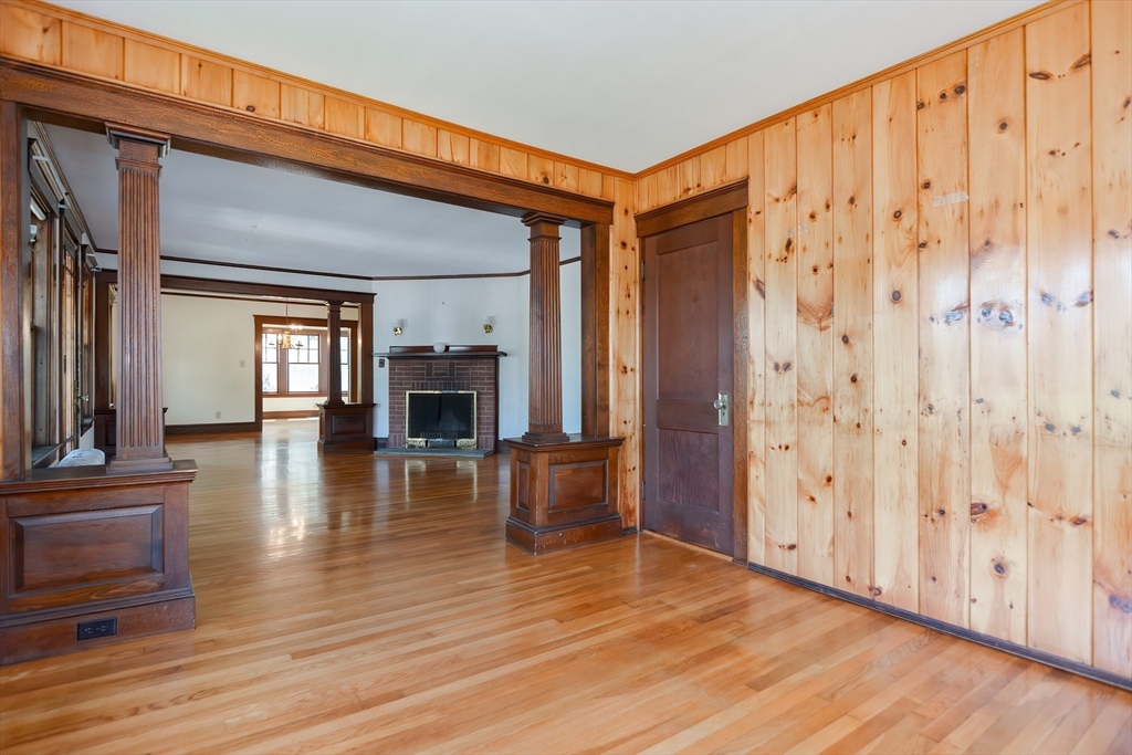 2 Prospect Street Milford, MA 01757 - Photo 9 of 31 a view of a livingroom with wooden floor and fireplace