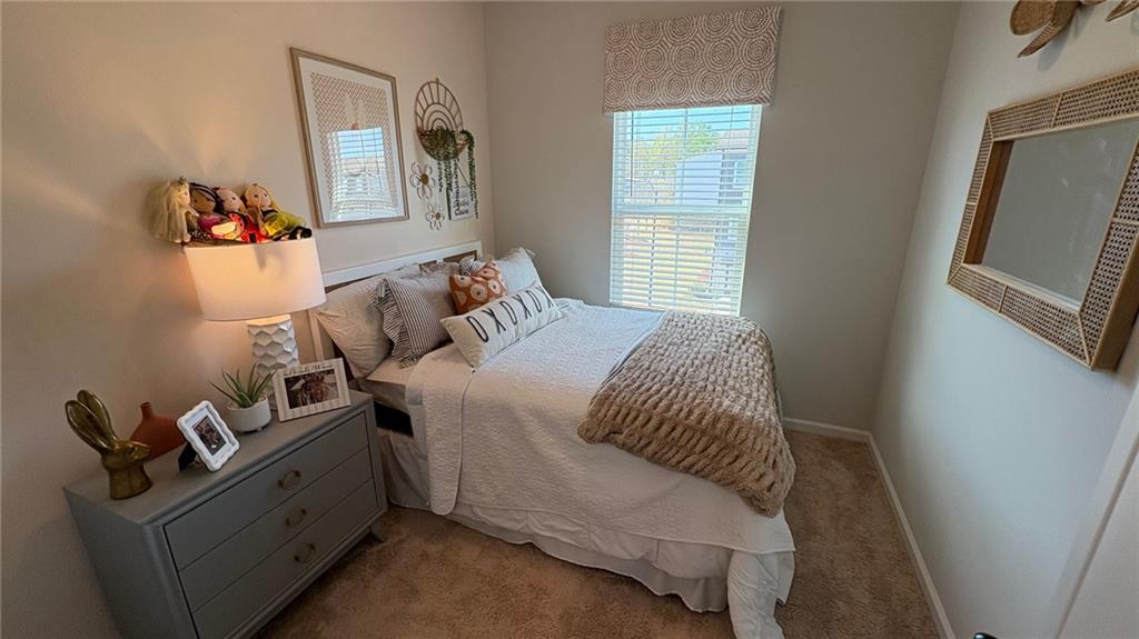 600 Tiller Way Acworth, GA 30102 - Photo 14 of 23 a bedroom with a bed and wooden floor