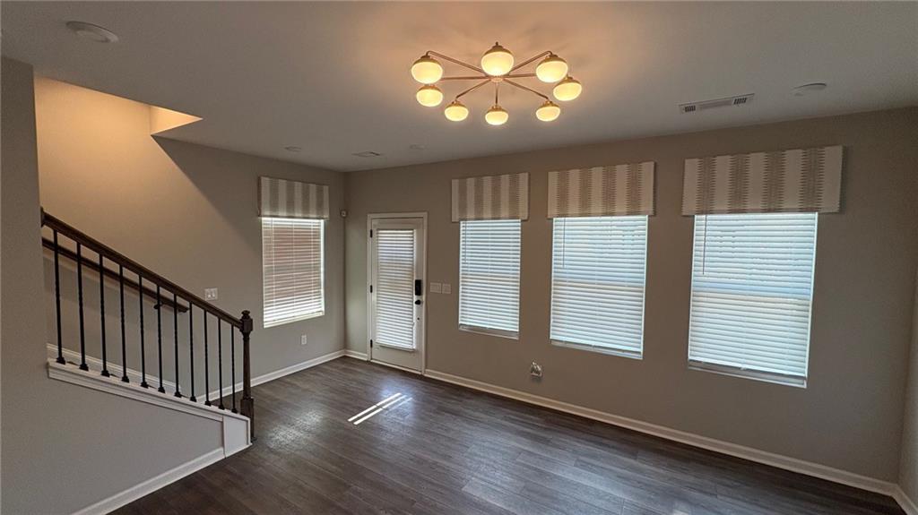 600 Tiller Way Acworth, GA 30102 - Photo 18 of 23 wooden floor in an empty room with a window