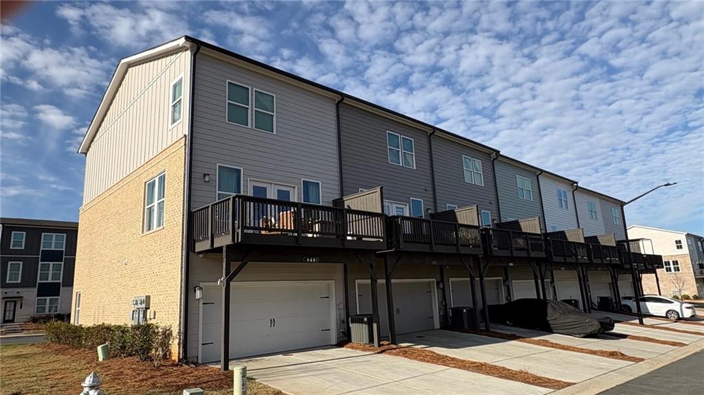 600 Tiller Way Acworth, GA 30102 - Photo 21 of 23 a view of a house with many windows