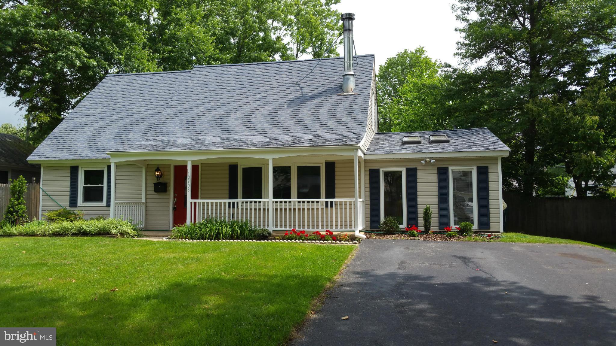 a view of a house with garden and yard