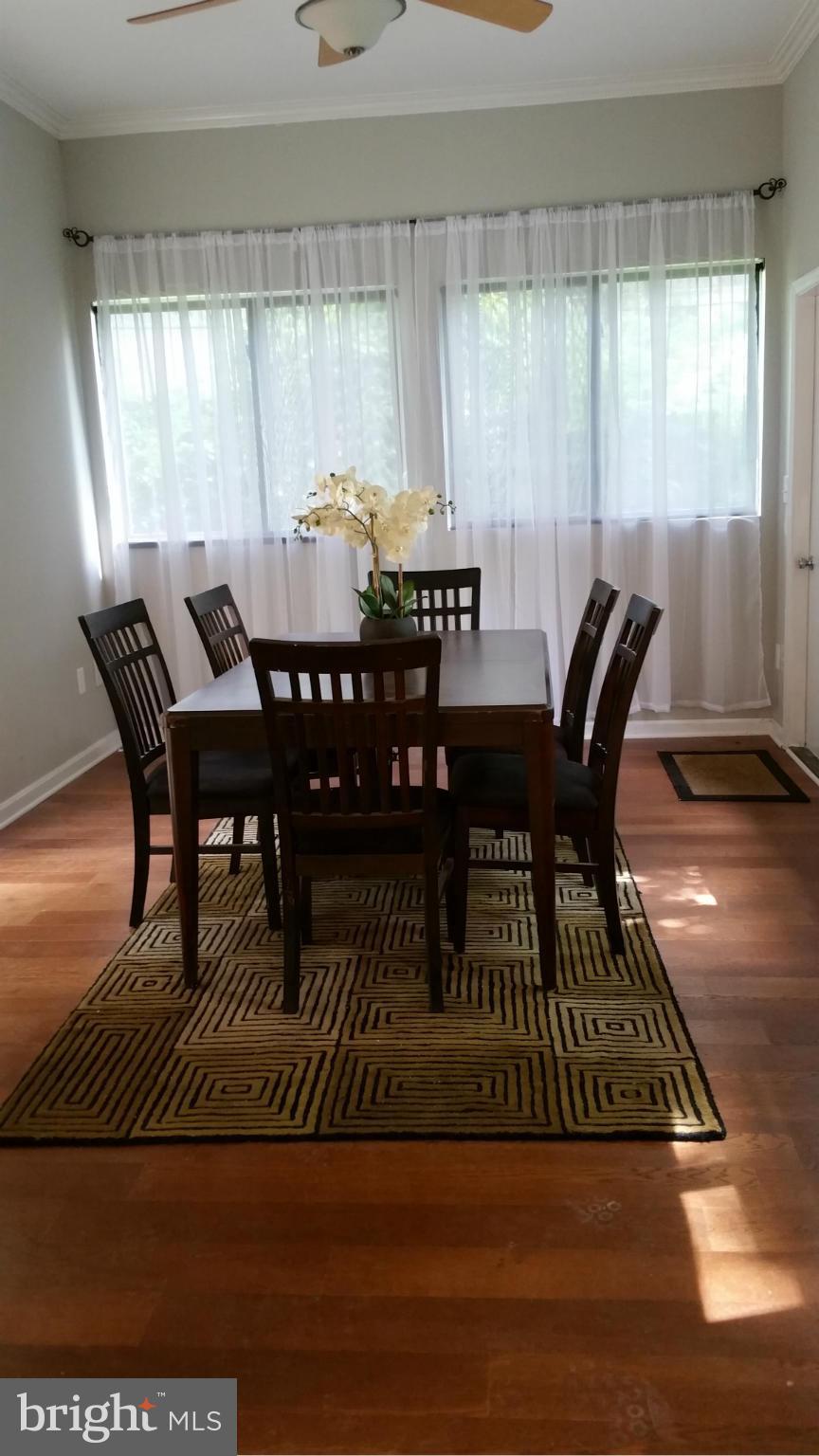 12408 Starlight Lane Bowie, MD 20715 - Photo 8 of 26 a view of a dining room with furniture and window
