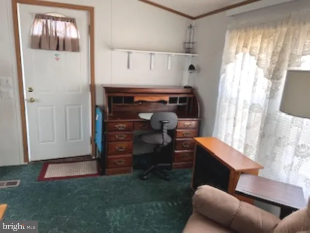 a room with furniture and a window