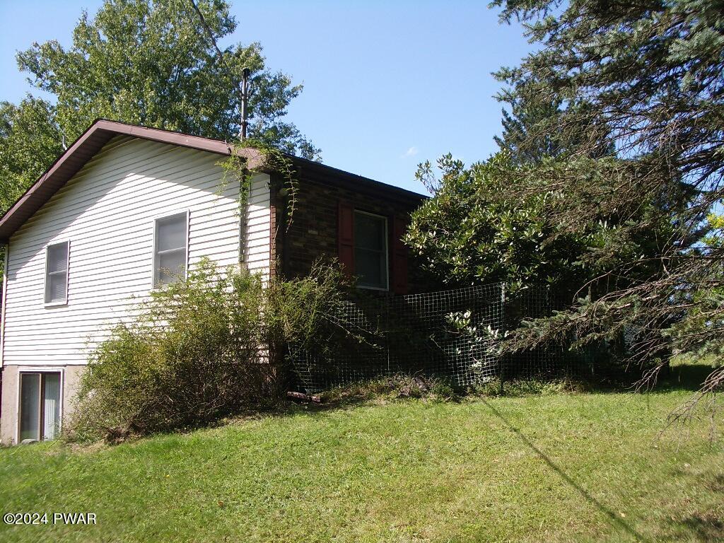 81 Tuthill Road Waymart, PA 18472 - Photo 27 of 29 a house that has a tree in it
