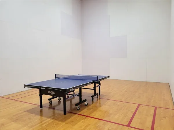 a view of a room with a table and chairs